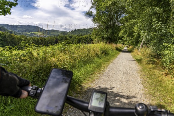 Sauerlandring cycle path, an 84 km long circular cycle path between the towns of Finnentrop, Eslohe, Schmallenberg and Lennestadt, mostly on former railway lines, here near Schmallenberg, Sauerland, North Rhine-Westphalia, Germany