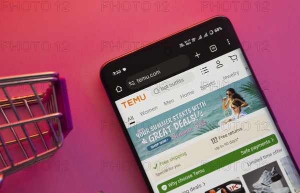 Dhaka, Bangladesh- 23 June 2025: A smartphone displaying the Temu website with a shopping cart is shown on a vibrant background
