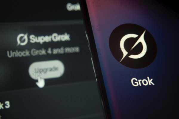 SuperGrok upgrade interface with Grok app prominently displayed on smartphone