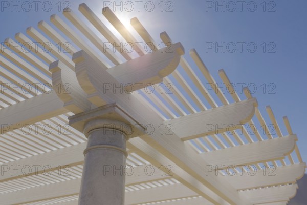 Detail abstract of A beautiful marble and wood pergola patio cover