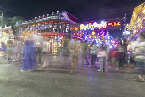 Neon lights, the legendary restaurant THE RED PIANO, Pub Street in the evening, entertainment district with bars and restaurants, Siem Reap, Cambodia