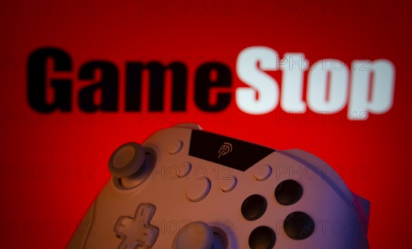 Dhaka, Bangladesh- 15 July 2025: A close-up of a gamepad with the GameStpo seen on screen in the background