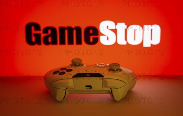 Dhaka, Bangladesh- 15 July 2025: Game controller in front of GameStop logo on a background