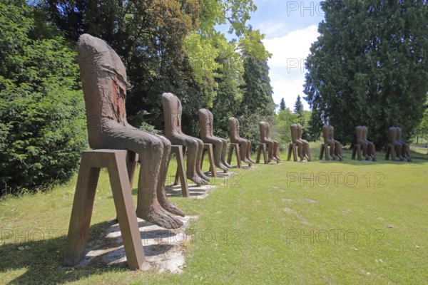 Sculpture Seated Figures by Magdalena Abakanowicz 2010, art installation, modern art, abstract art, steel sculpture, rusty, row of chairs, chairs, row, series, circle, 9 seated figures, torso, without, none, none, missing, head, synchronous, Gustavsgarten, Bad Homburg, Taunus, Hesse, Germany