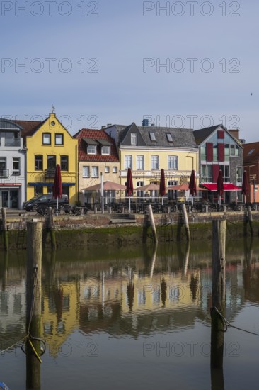 Building at the harbour, reflection, Husum, North Sea, North Frisia, Schleswig-Holstein, Germany