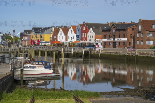 Building at the harbour, skyline, boats, reflection, Husum, North Sea, North Frisia, Schleswig-Holstein, Germany