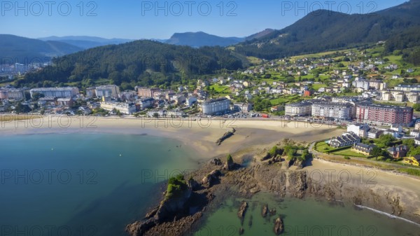 Aerial view of covas beach meeting the charming town of viveiro, nestled amidst the stunning landscapes of galicia, spain, creating an idyllic coastal scene