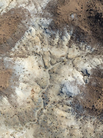 Broken, rocky ground with sparse vegetation. Aerial view. Drone shot. Southern Namibia