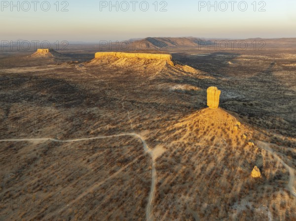The Vingerklip (rock finger) and the Ugab Valley Terraces are surrounded by thornbush and mopane (Colophospermum mopane) savanna. Aerial view. Drone shot. Damaraland, Namibia