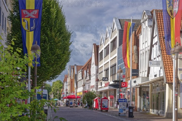 Buildings and shops in Lange Straße in the historic old town centre of Nienburg an der Weser. Nienburg, Lower Saxony, Germany