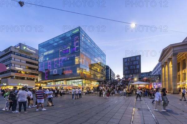Stuttgart Art Museum in the evening with light installation and people on the steps. Long Night of the Museums in Stuttgart. Stuttgart, Baden-Württemberg, Germany