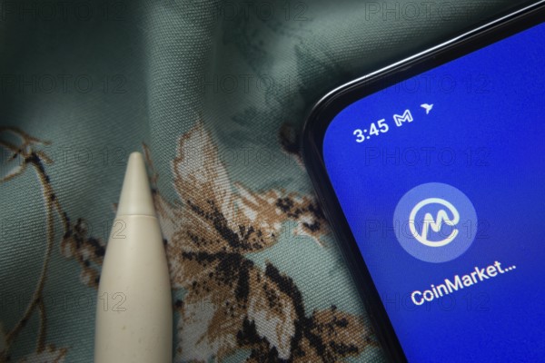 Dhaka, Bangladesh- 07 May 2025: Coinmarketcap app icon is seen on smartphone