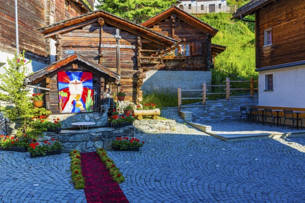 Flower-decorated altar for the Corpus Christi procession, historic village centre, Grimentz, Val d'Anniviers, Valais Alps, Canton Valais, Switzerland