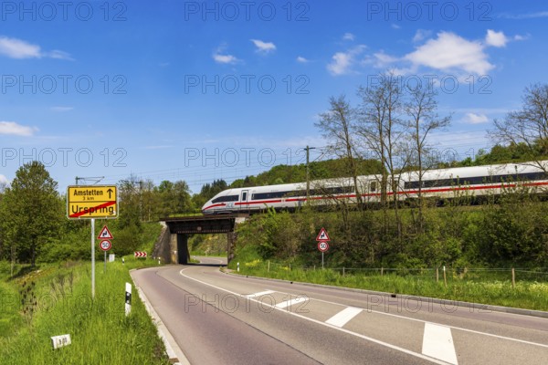 InterCityExpress ICE en route on the Swabian Alb near Lonsee. Landscape with railway bridge near Urspring on the Filstalline railway line in spring. Lonsee, Baden-Württemberg, Germany