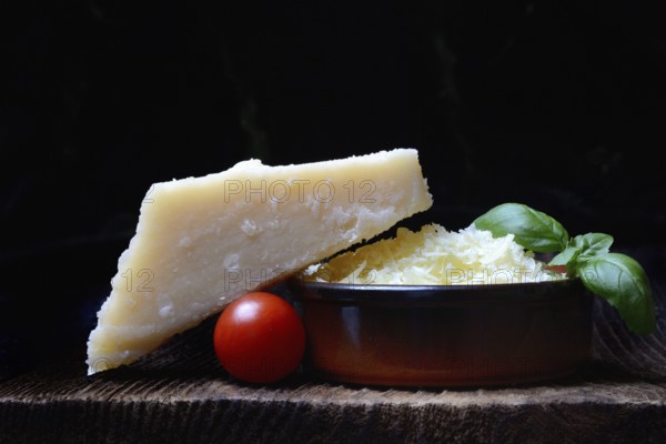 Parmesan cheese, grated cheese in rind and piece of Parmesan, Italy