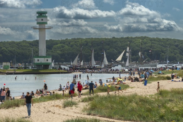 Windjammer Parade 2025 on the Kiel Fjord at the end of Kiel Week, tall ships, three-masters, spectators, Falkensteiner Strandleben, lighthouse, summer weather, sunshine, forest, Kiel, Schleswig-Holstein, Germany