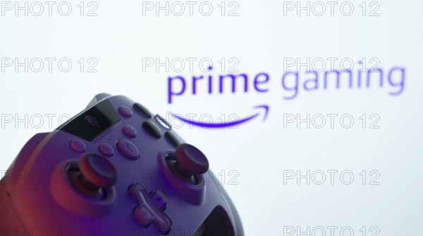 Dhaka, Bangladesh- 22 June 2025: A close-up of a white gamepad with the Prime Gaming seen on screen in the background