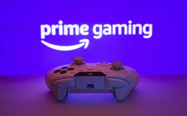 Dhaka, Bangladesh- 22 June 2025: A close-up of a white gamepad with the Prime gaming seen on screen in the background