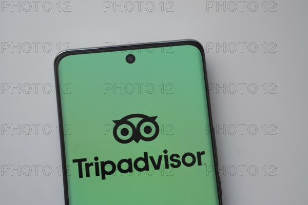 Dhaka, Bangladesh- 22 June 2025: The logo of the Tripadvisor is displayed on a smartphone screen