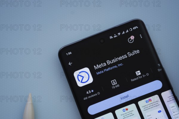Dhaka, Bangladesh- 29 May 2025: On a blue surface, a smartphone displays the Meta Business Suite app within the Google Play Store
