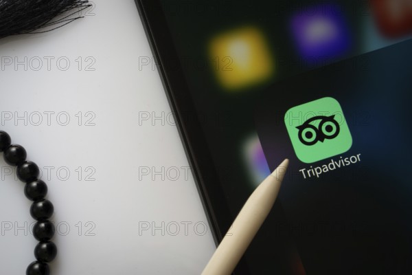 Dhaka, Bangladesh- 22 June 2025: A close up of an iPad screen displaying the Tripadvisor app
