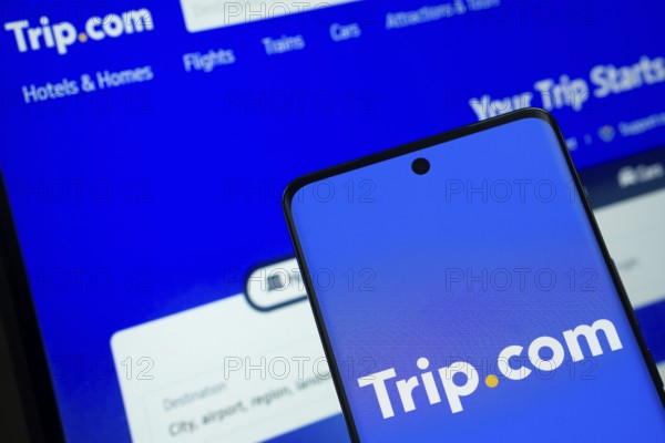 The logo of the trip.com is displayed on a smartphone screen, and the website trip.com is visible on a computer screen in the background