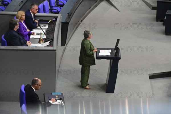 Federal Chancellor Friedrich Merz (CDU) and parts of his cabinet sit on the government bench, whilec, co-chair of the Greens parliamentary group, responds to the Federal Chancellor's government statement