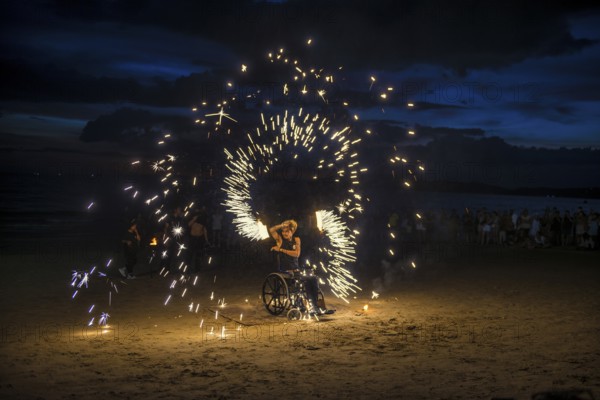 Fire show, jugglers with fire, wheelchair users, Ao Nang Beach, sunset, Ao Nang, Krabi, Thailand