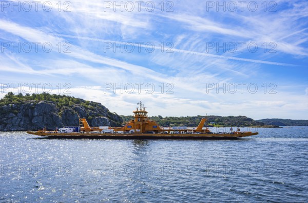 The car ferry SATURNUS, which operates as a floating road between the archipelago, navigates off the coast near Lysekil, Bohuslän, Västra Götalands län, Sweden, Scandinavia