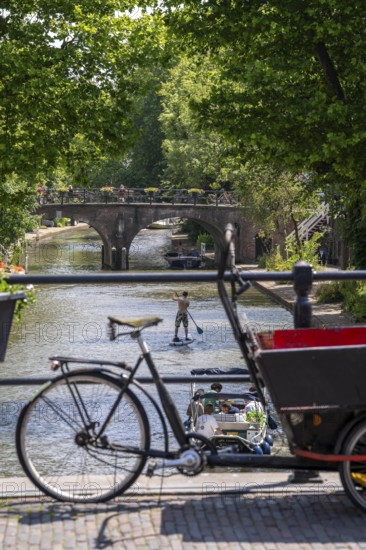 The old town centre of Utrecht, Oudegracht, around 2 km long with many old houses, shops, restaurants directly on the canal, many bridges, boat traffic of all kinds, Netherlands