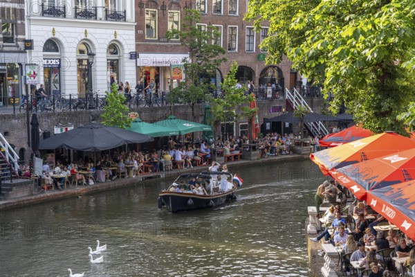 The old town centre of Utrecht, Oudegracht, around 2 km long with many old houses, shops, restaurants directly on the canal, many bridges, boat traffic of all kinds, Netherlands