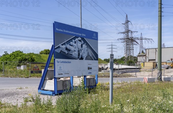 Construction site sign for thyssenkrupp Steel's first direct reduction plant, the climate-neutral steel production project, at the existing steelworks in Duisburg-Farn, pig iron production without a conventional blast furnace but using hydrogen, due to go into operation by the end of 2027, North Rhine-Westphalia, Germany