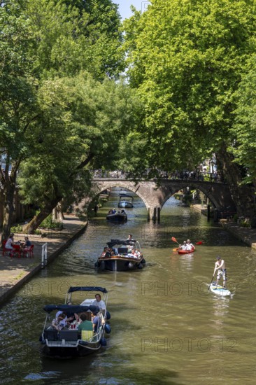 The old town centre of Utrecht, Oudegracht, around 2 km long with many old houses, shops, restaurants directly on the canal, many bridges, boat traffic of all kinds, canal cruise, Netherlands