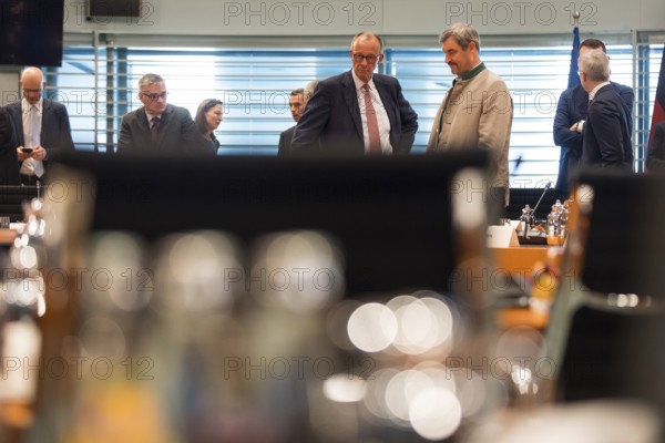 Federal Chancellor Friedrich Merz (l, CDU) and Markus Söder (CSU Chairman and Minister President of Bavaria) in front of the meeting between Federal Chancellor Friedrich Merz and the heads of government of the federal states in the International Conference Hall of the Federal Chancellery, Berlin, 18 June 2025