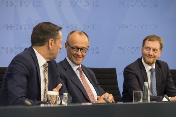 Olaf Lies (SPD, Minister President of Lower Saxony), Federal Chancellor Merz (CDU, Federal Chancellor) and Michael Kretschmer (CDU, Minister President of the Free State of Saxony) during a press conference after the consultation between Federal Chancellor Friedrich Merz and the heads of government of the federal states in the Federal Chancellery, Berlin, 18 June 2025
