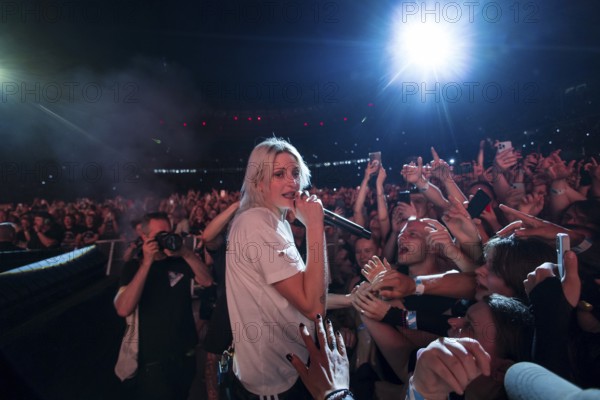 Emily Armstrong, lead singer of Linkin Park in the photo pit between the audience live on From Zero World Tour 2025 at the Olympiastadion Berlin on 18 June 2025
