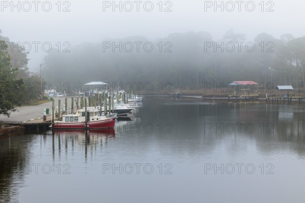Private fishing boats in the harbor at Ocean Springs, Mississippi on a foggy morning