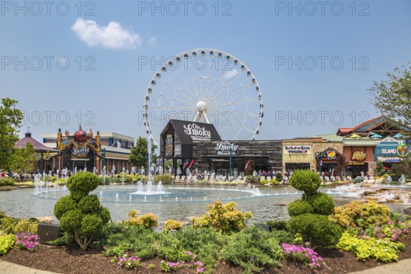 The Wheel ferris wheel behind the Ole Smoky Moonshine store at The Island recreation center in Pigeon Forge, Tennessee