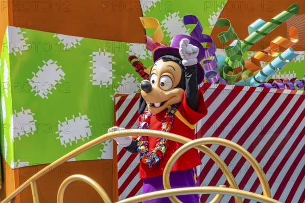 Disney character riding on float during parade through the Frontierland area of Magic Kingdom at Walt Disney World, Orlando, Florida