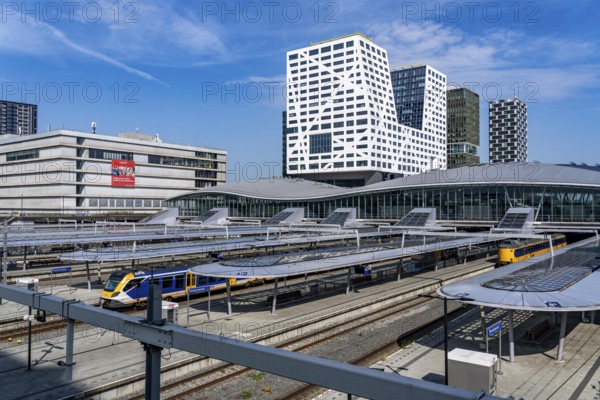 Utrecht Centraal railway station, tracks and concourse, trains of Nederlandse Spoorwegen N.V. state railway company, office building in the city centre, Netherlands