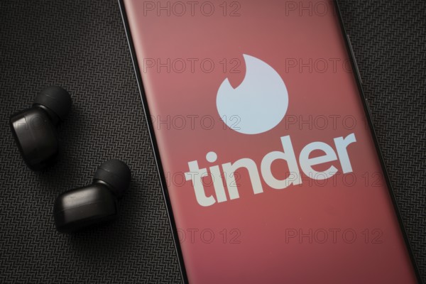 Dhaka, Bangladesh - 18 March 2025: The logo of the tinder is displayed on a smartphone screen