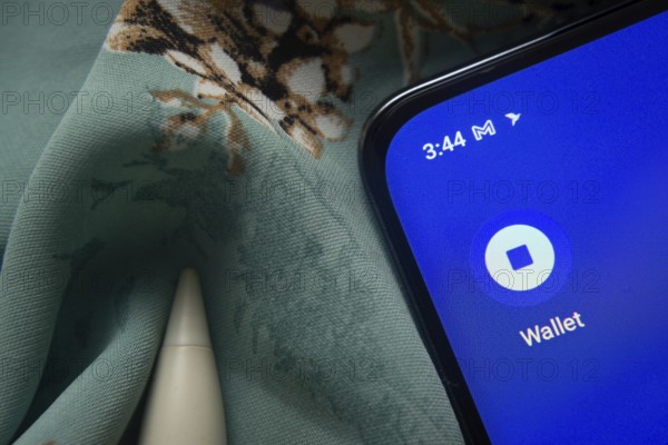 Dhaka, Bangladesh- 07 May 2025: Coinbase Wallet app icon is seen on smartphone