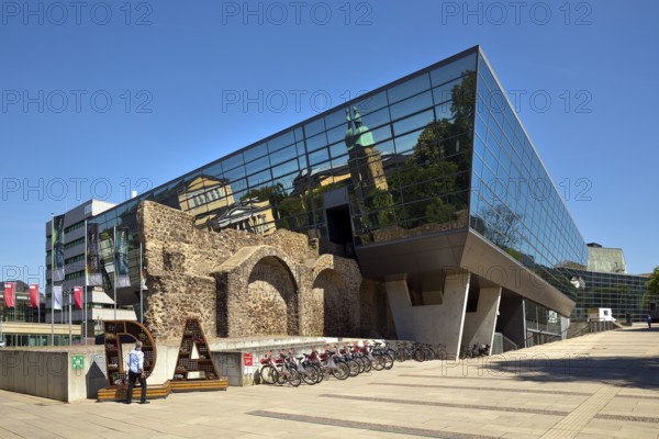 West side of the Darmstadtium congress centre with historic city wall in the centre of Darmstadt, Hesse, Germany