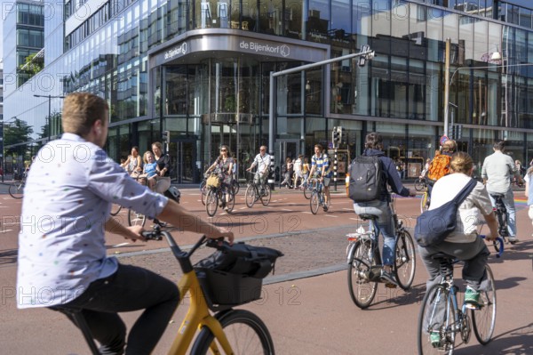 Central cycle path along the Vredenburg, in the city centre of Utrecht, lanes for pedestrians, cyclists and local traffic are separated, dense traffic, no car/truck traffic, Utrecht, Netherlands
