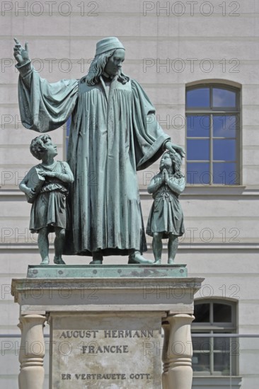Monument to theologian, pedagogue and poet, August Hermann Francke, man with two children, protect, protect, care, gesture, arm, high, above, bless, hymn writer, interaction, Halle an der Saale, Saxony-Anhalt, Germany