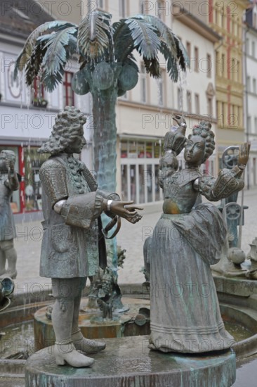 City fountain by Bonifatius Stirnberg 2000, bronze sculptures on the historical city history with symbols historical princely couple, aristocrats, couple, baroque, clothing, dancing couple, palm tree, Weißenfels, Saxony-Anhalt, Germany
