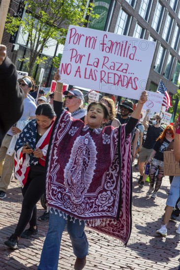 Detroit, Michigan USA - 14 June 2025 - Thousands gathered for a 'No Kings' rally, protesting President Trump's actions against immigrants and against democratic institutions. Afterwards the crowd marched to the ICE office