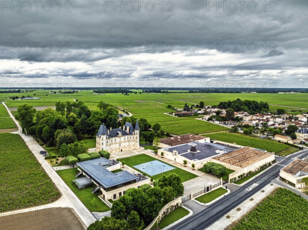 Chateau Pichon Longueville Baron Vineyard and grape fields around Pauillac from a drone, Bordeaux, Gironde, Nouvelle-Aquitaine, France
