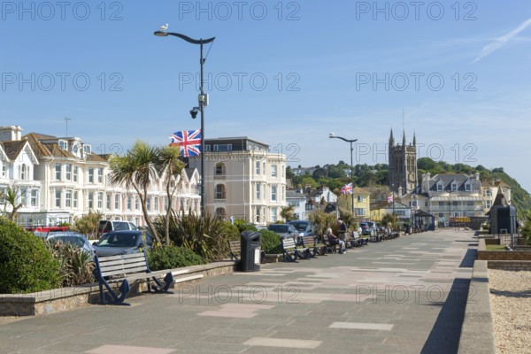 Seafront promenade view east towards St Michael's church, Teignmouth, south Devon, England, UK