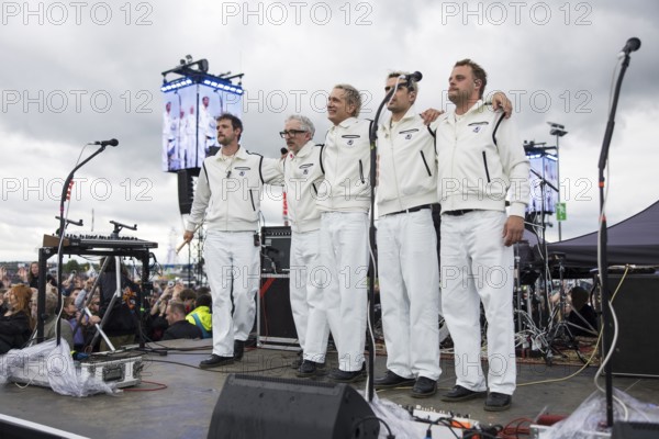 Steffen Israel (guitarist and keyboarder), Felix Brummer (singer), Karl Schumann (guitarist) and Till Brummer (bassist) of Kraftklub at a secret gig of the band at the Rock am Ring Festival on Saturday, Nürburgring race track race track, 07.06.2025